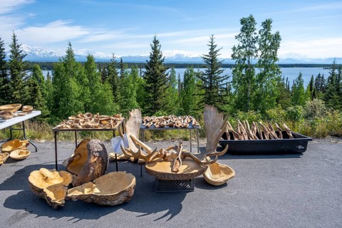 Sales stand for souvenirs with elk antlers and wood carving, Alaska, USA