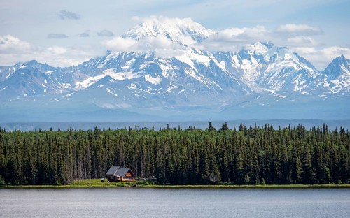 House on Lake Willow Lake, Taiga landscape with high glaciated mountain peak Mount Drum, Wrangell