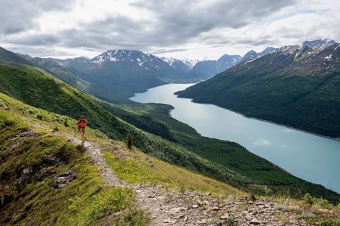 Climbers on a hiking trail, view of blue lake and mountains on Twin Peaks Trail, Eklutna Lake,