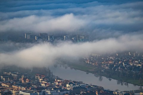 Aerial view of the city of Heidelberg on the Neckar, fog landscape of low-hanging clouds and fog