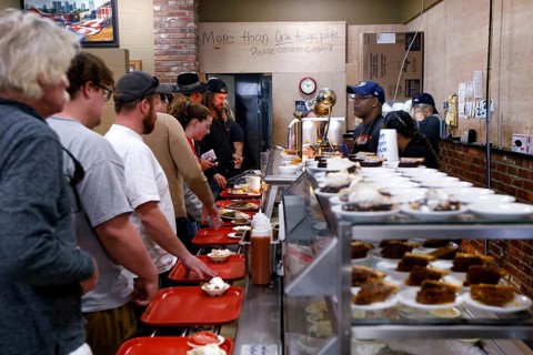 People stand in line at Arnold's Country Kitchen in Nashville, Nashville, Tennessee, USA
