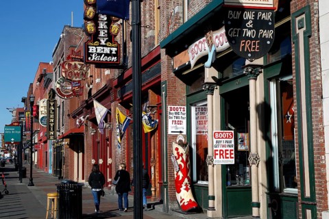 People walking along Broadway Street in daylight, Nashville, Tennessee, USA
