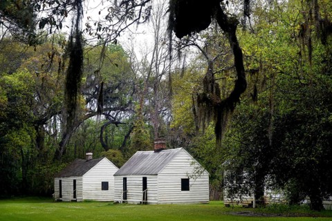 Two white slave huts in a tree-lined area, Charleston, South Carolina, USA