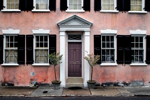 Pink-painted historic house with multiple windows in Charleston, Charleston, South Carolina, USA