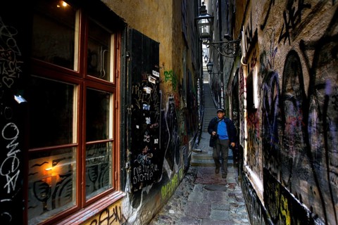 Narrowest alley in Gamla Stan with colorful graffiti and historic charm, Stockholm, Gamla Stan,