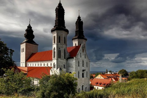 The distinctive cathedral rises under a dramatic sky in the old town, Visby, Gotland, Sweden