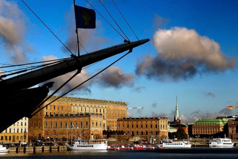 Royal castle in Gamla Stan seen from Skeppsholmen, with dramatic sky and clouds, Stockholm, Gamla