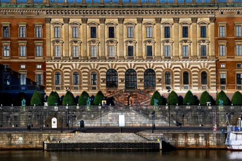 Stockholm's Royal Palace is majestically perched on the water with a detailed façade, Stockholm,