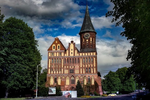 Majestic cathedral with impressive tower against blue sky, Kaliningrad, Russia