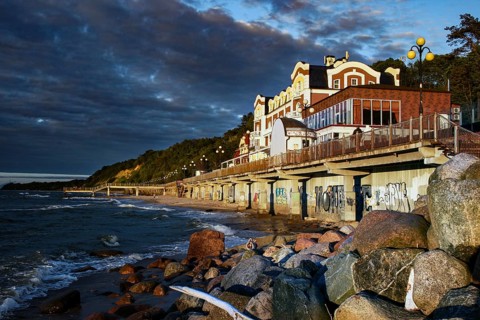 Promenade on the beach at dusk with coastal houses, Svetlogorsk, Kaliningrad, Russia