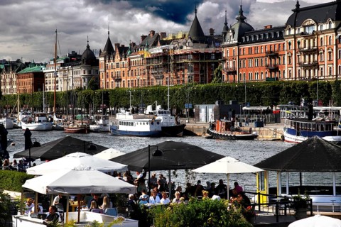 Lively waterfront area on Strandvägen with boats, cafés and impressive architecture, Stockholm,