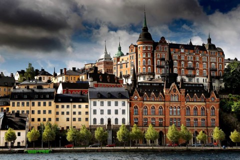 Historic buildings of Södermalm, Stockholm viewed in dramatic light from Riddarholmen, Stockholm,