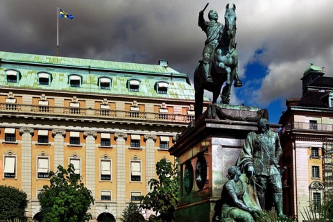 Gustav II Adolf monument on Gustav Adolfs Torg in front of imposing historic buildings, Stockholm,