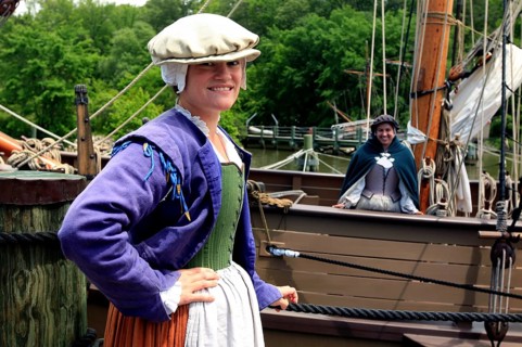 Woman in historic costume standing in a harbor in Jamestown Settlement, Jamestown, Virginia, USA