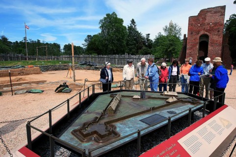 Visitors look at a model at Jamestown National Historic Site, Jamestown, Virginia, USA