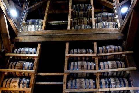Shelves full of stacked wooden barrels in a distillery warehouse, Lynchburg, Tennessee, USA