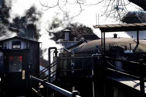 Exterior view of Jack Daniel's Distillery with smoking kettle, Lynchburg, Tennessee, USA