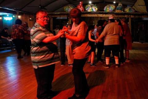 People dancing on the dance floor at Randol's restaurant, Lafayette, Louisiana, USA