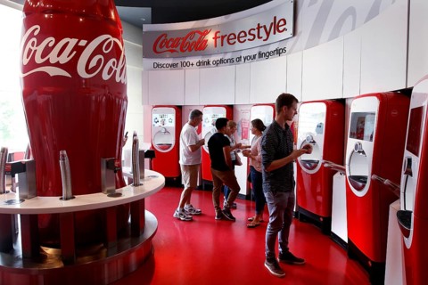 Visitors to the Coca-Cola Museum tasting room in Atlanta use the Coca-Cola Freestyle vending