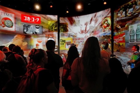 Visitors view interactive canvases at the Coca-Cola Museum in Atlanta, Atlanta, Georgia, USA