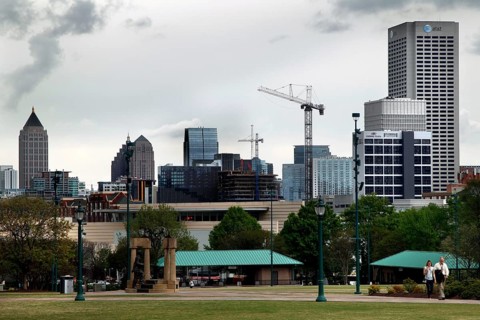Atlanta skyline with cranes and green landscape, Atlanta, Georgia, USA