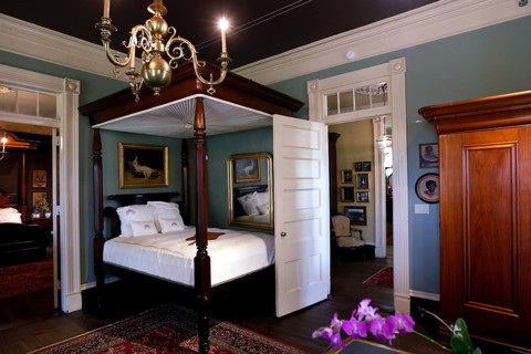 Classic bedroom with canopy bed and antique furniture, zero