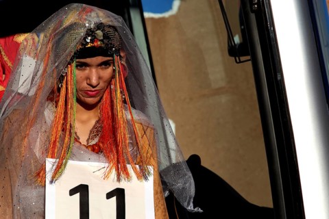A woman in festive dress at the Miss Election during the Fête des Roses, El Kelâa m'Gouna,