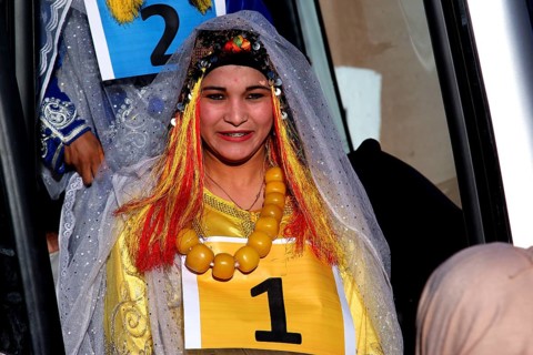 A woman in traditional dress takes part in a miss contest during the Fête des Roses, El Kelâa