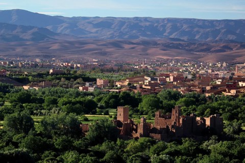Panoramic view of the green Rose Valley with Kasbah and surrounding mountains, El Kelâa m'Gouna,