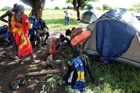 Mursi people in a tent camp under a tree, Mago National Park, Ethiopia