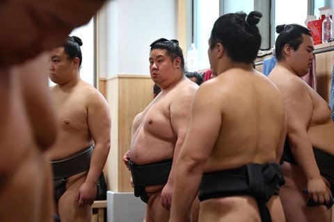 Sumo wrestlers stand concentrated training at Ryogoku Center, Tokyo, Ryogoku, Japan