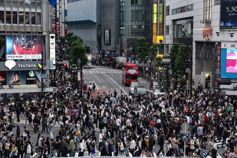 Large crowd crosses the busy Shibuya Intersection in Tokyo, Tokyo, Shibuya, Japan