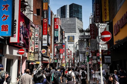 Busy street scene in Shibuya with lots of people and colorful advertisements, Tokyo, Tokyo, Japan