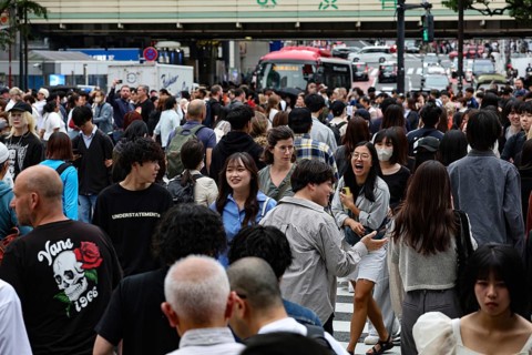 People of various ages cross the Shibuya Intersection in Tokyo, Tokyo, Shibuya, Japan