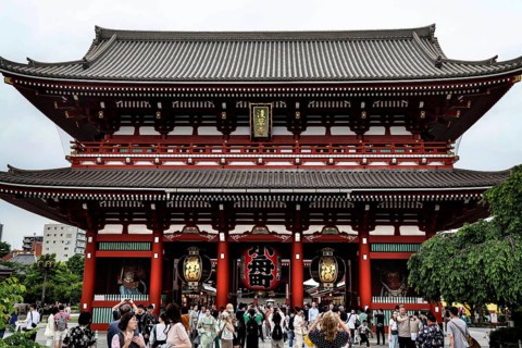 Entrance gate of Senso-ji Temple with crowd, traditional Japanese design, Tokyo, Japan
