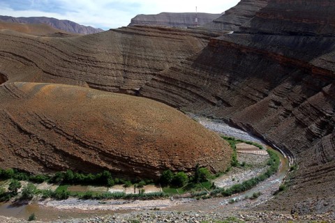Stratified geological formations in Dadès Canyon with a river, Dadès Gorge, Morocco