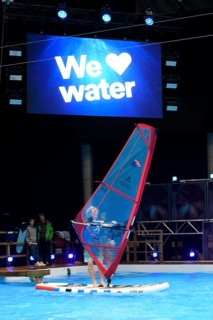 Press photo of wind surfer Windsurfer in the large XXL pool in Hall 17 of Messe Boot Düsseldorf, in