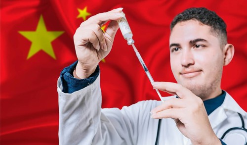 Doctor holding syringe on China flag background. Medical professional holding syringe with Chinese