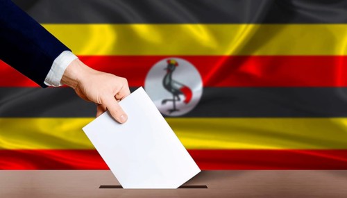 Hand placing a ballot in ballot box with the Ugandan flag in the background. Uganda presidential