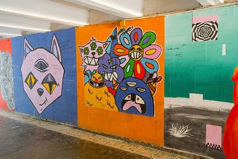 Colourful graffiti full of pop cultural elements and creative, surreal representations, underground