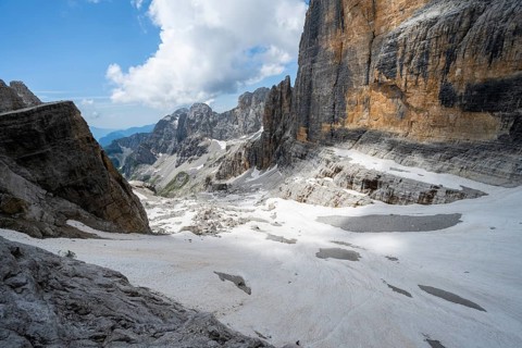Spectacular mountain landscape with steep cliffs and remains of the Vedretta d'Ambiez glacier, Via