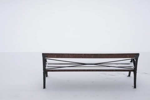 Bench in snow, wintery Turku or Swedish Åbo, Varsinais-Suomi, Finland