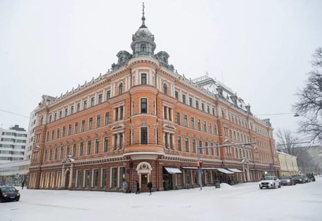 Historic building on the corner of Linnankatu Aurakatu, snowy roads, Turku or Swedish Åbo,
