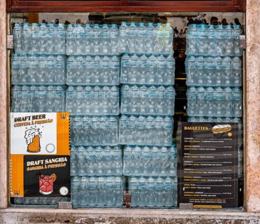 Stacks of seltzer bottles in a bar window, Sintra, Lisabon, Portugal