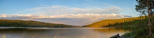 Extensive panorama of Gutulsjön lakeside under bright skies, peaceful atmosphere, Gutulia National
