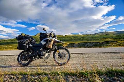 Dalholen, Innlandet, Norway, BMW G 650 GS Sertao enduro motorcycle on a quiet path in a wide hilly