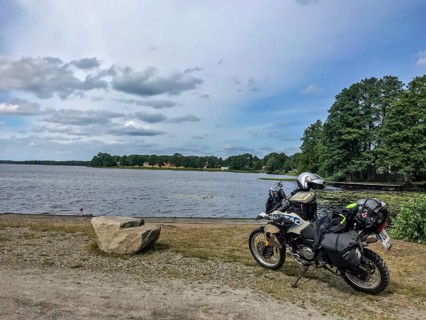 Urshult, Kronobergs län, Sweden, BMW G 650 GS Sertao enduro motorcycle next to a lake under cloudy