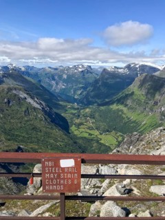 Geiranger, Møre og Romsdal Province, Norway, viewpoint with sign warning of hands or clothing
