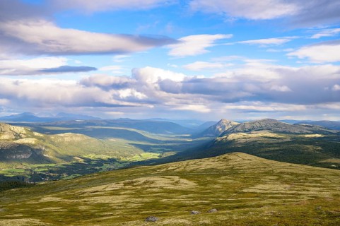 Tylldal, Innlandet, Norway, panoramic view over mountains and valleys with dynamic cloudy skies