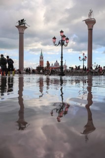 The pillars of Piazzetta, St. Mark and St. Theodorus, at high tide, Acqua Alta, San Marco, Venice,